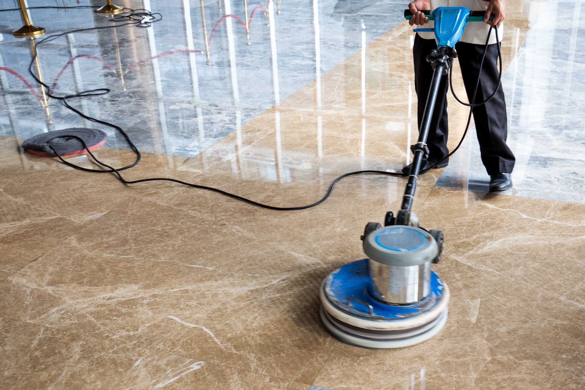 polishing floor with scrubbing machine.