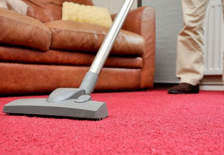 vacuum cleaning red carpet.